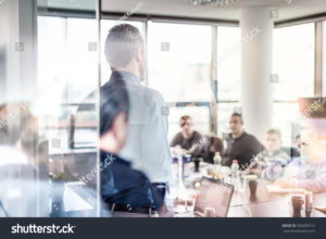 Guy leading meeting in conference room